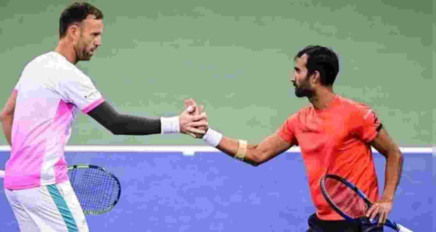 Yuki Bhambri celebrating a point with his doubles partner Michael Venus in their fourth round match at the US Open.