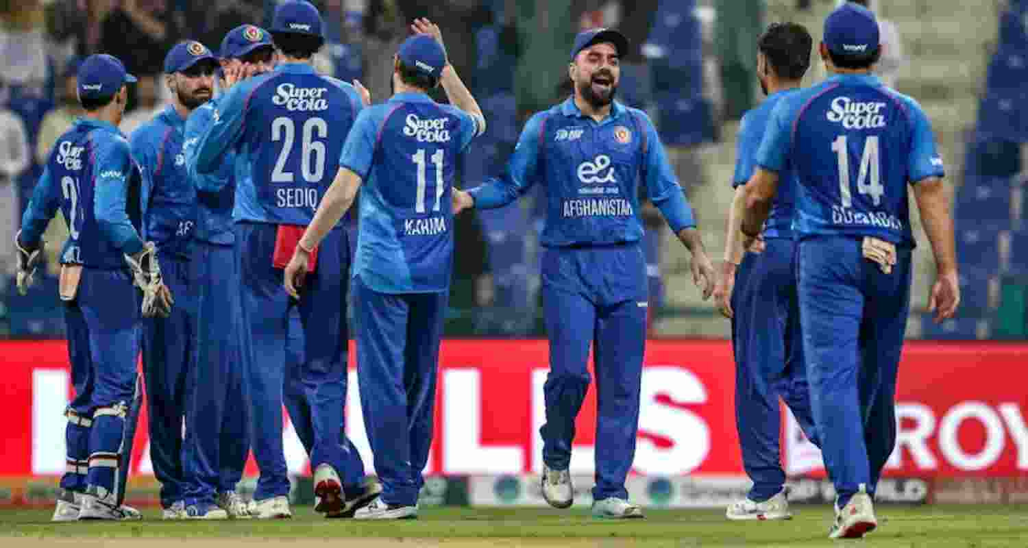 Afghanistan players celebrating a wicket against Hong Kong in the Asia Cup opener at Abu Dhabi.
