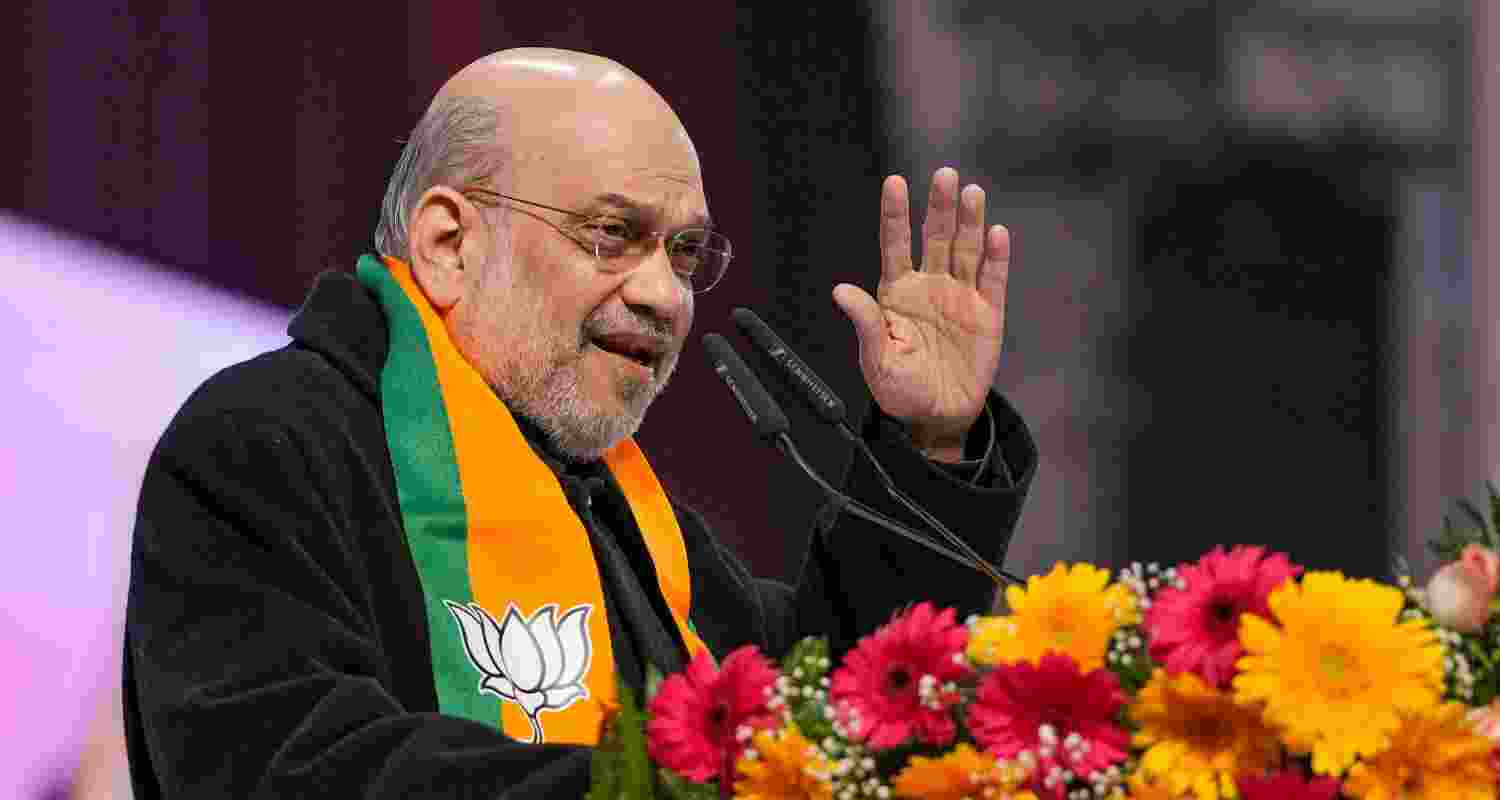Union Home Minister Amit Shah and BJP leader Jay Panda at the 'Jhuggi Basti Pradhan Sammelan', in New Delhi, Saturday.