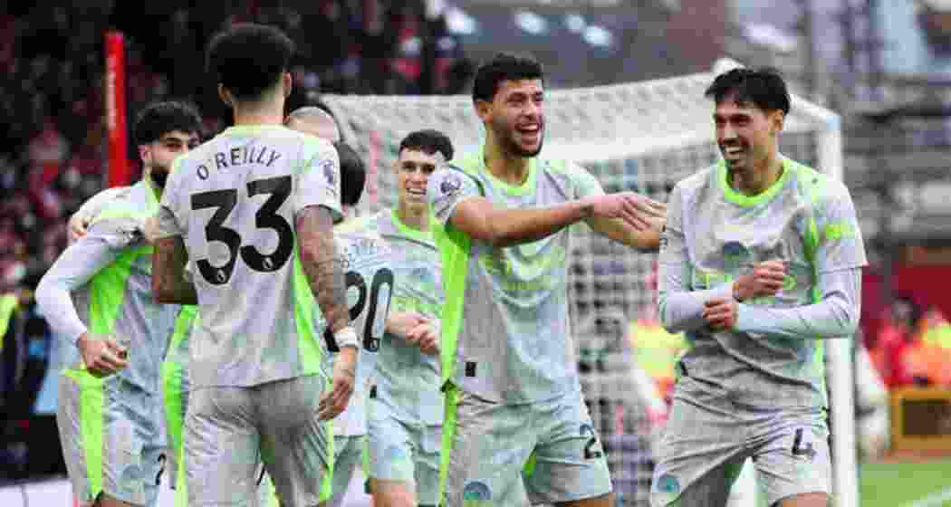 Arsenal’s players celebrate after scoring against Brighton.