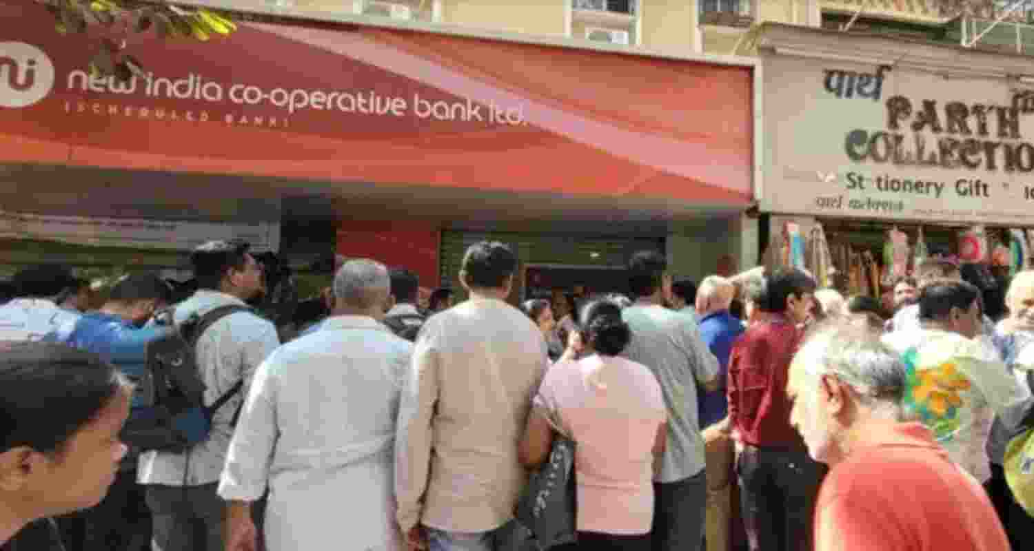 People queue outside New India Co-operative Bank in Kandivali West, Mumbai, on Friday. Image: X