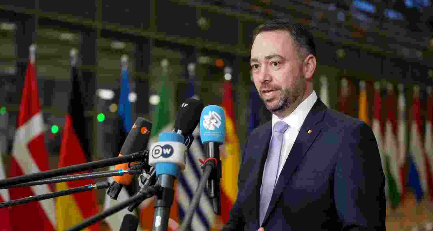 Belgium's Foreign Minister Maxime Prevot speaks with the media as he arrives for a meeting of EU foreign ministers at the European Council building in Brussels.