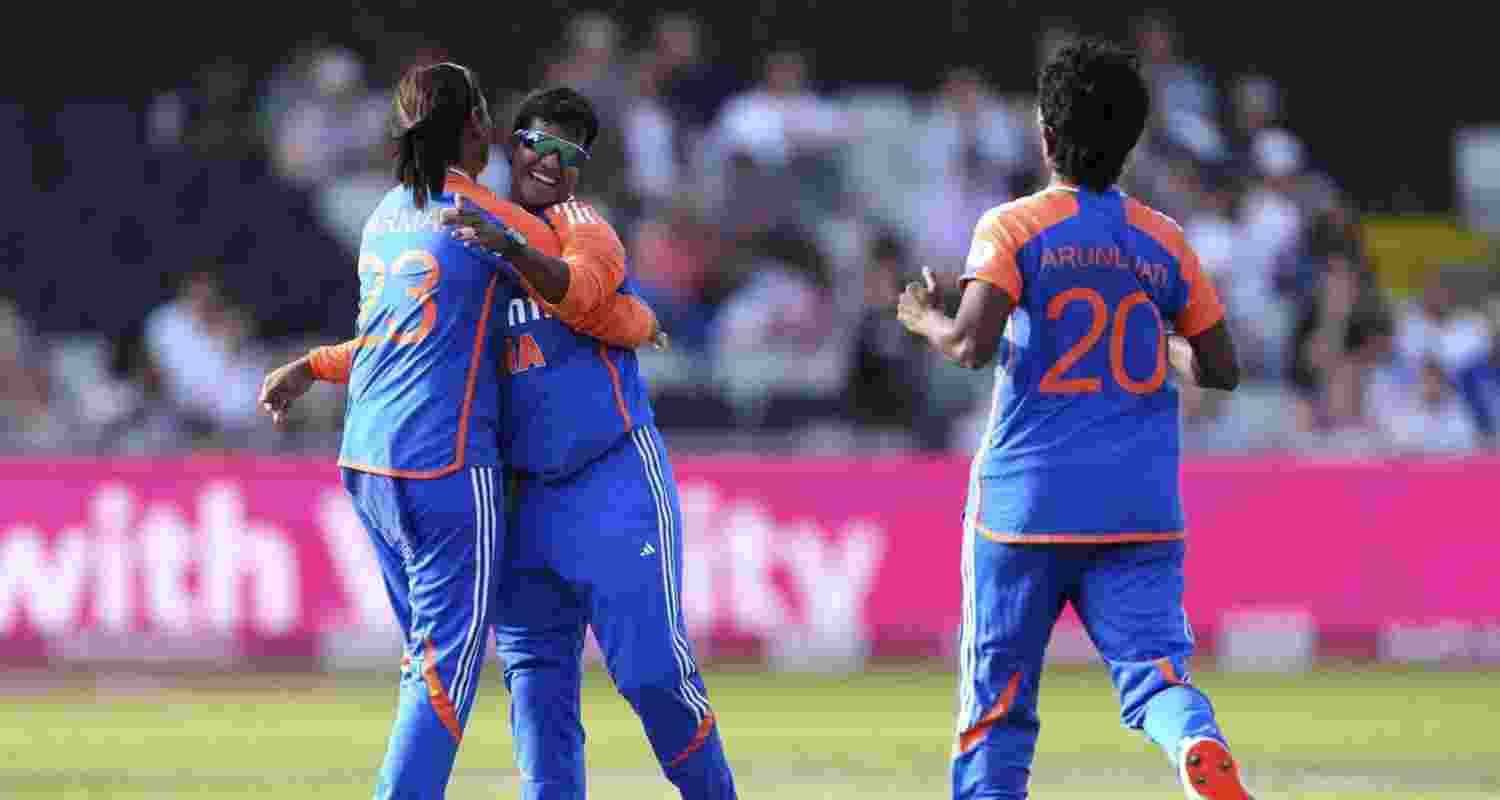 Indian women players celebrate a wicket during the fourth T20 international match against England.