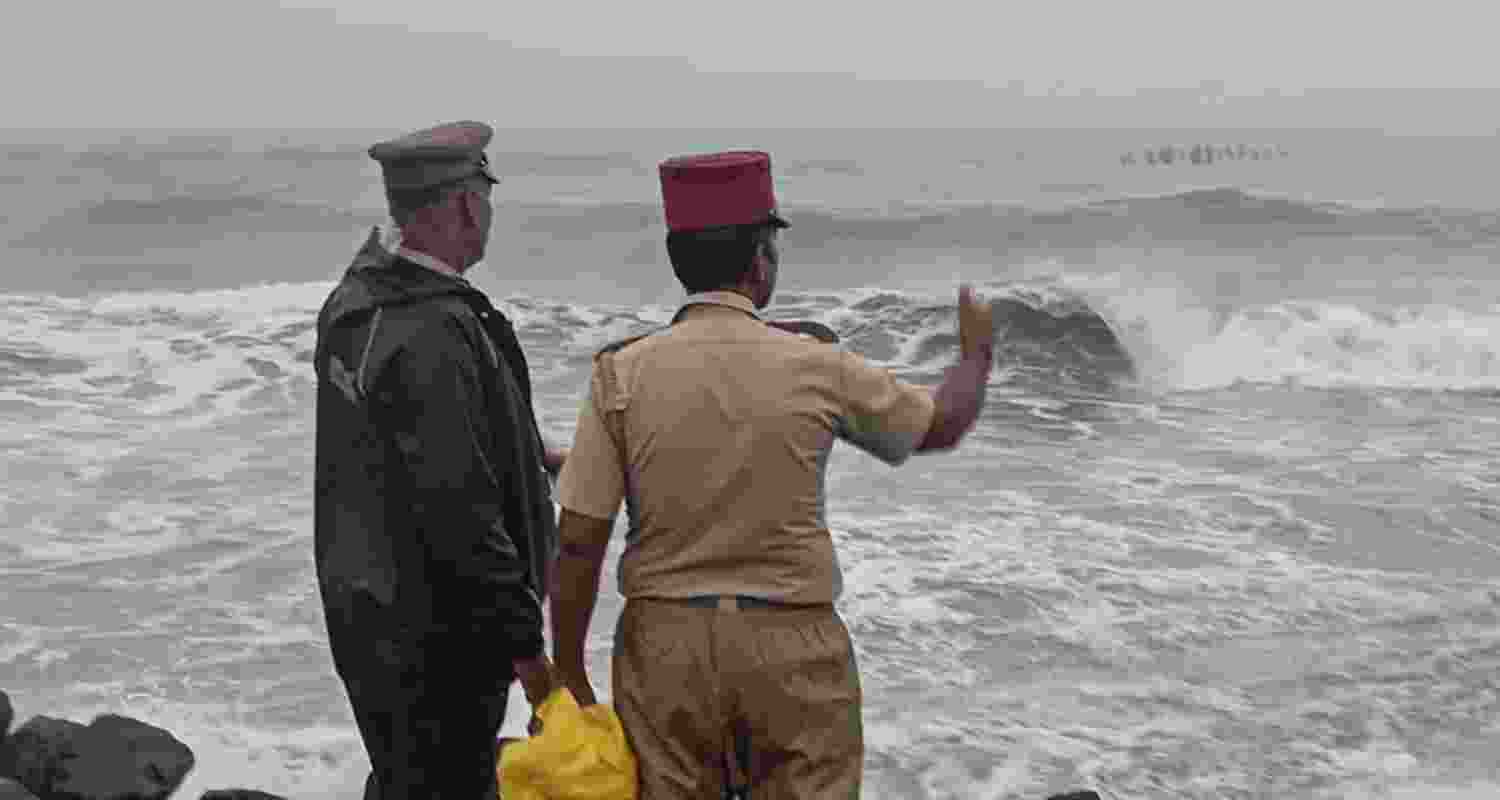  Security personnel conduct inspection as sea waves crash against the shore amidst a warning issued by the India Meteorological Department (IMD) that a deep depression over the southwest Bay of Bengal is likely to intensify into Cyclone 'Fengal' and move towards Tamil Nadu, in Puducherry, Wednesday, Nov. 27, 2024.