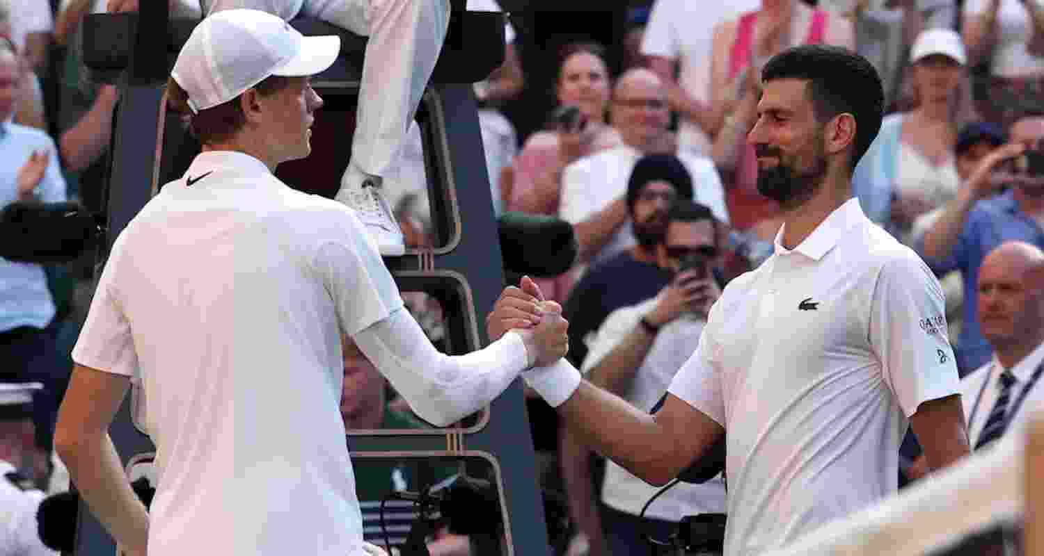 Italy's Jannik Sinner shakes hands with Serbia's Novak Djokovic after winning his semifinal match.