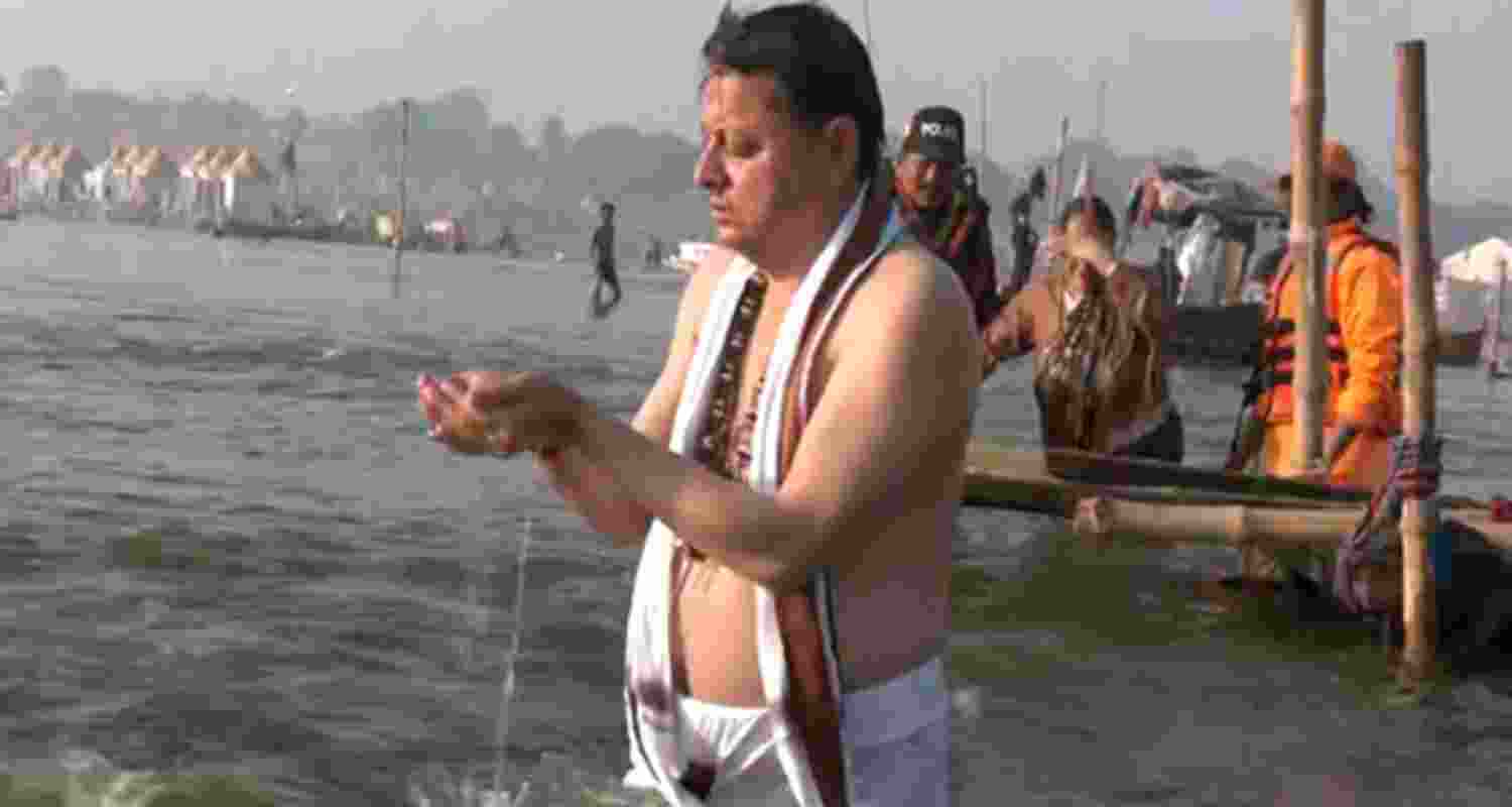 Uttarakhand CM Dhami takes holy dip in sangam with family
