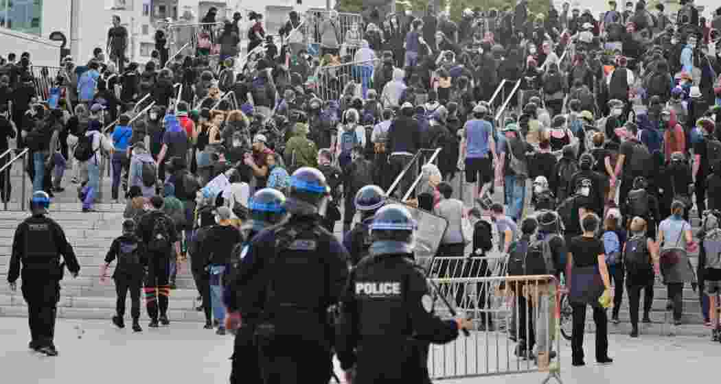 Protesters have blocked roads, set blazes and were met with volleys of police tear gas in Paris and elsewhere in France.