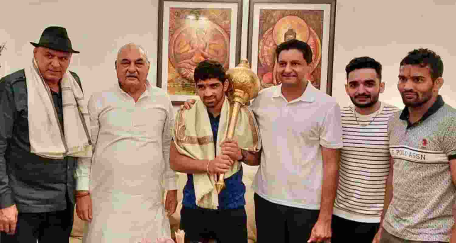 Bhupinder Hooda and Deepender Hooda with Olympic medalist wrestler Aman Sehrawat. 