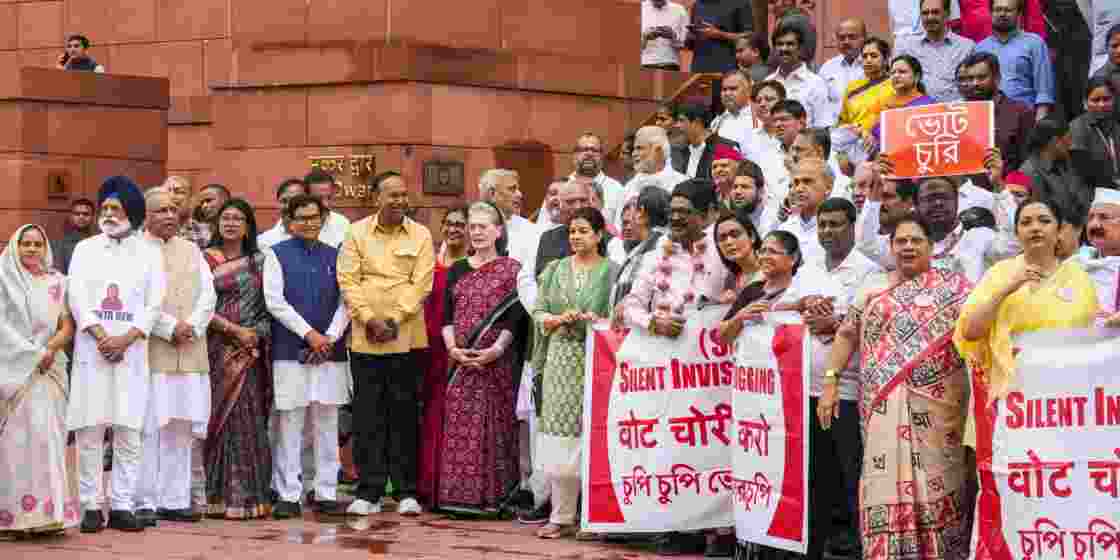 INDIA bloc members during a protest over the issues of alleged 'poll fraud' and SIR of electoral rolls.