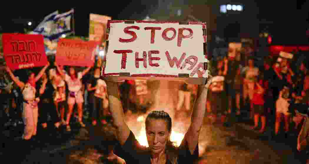 Protesters in Tel Aviv demand a ceasefire and hostage release, while Hamas militants crack down on anti-government demonstrations in Gaza. 