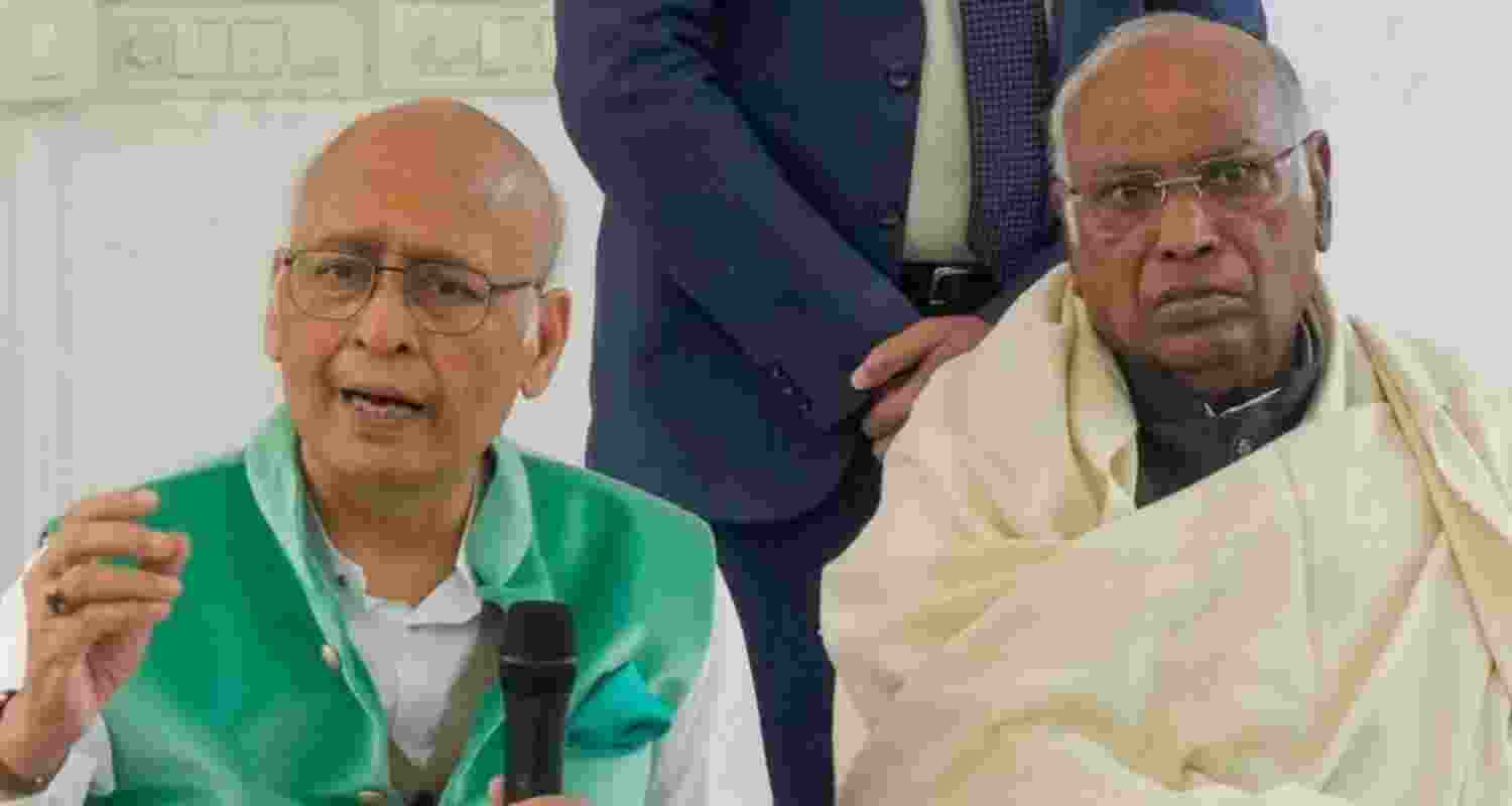 Congress President Mallikarjun Kharge, right, and party leader Abhishek Manu Singhvi address a press conference in New Delhi on Wednesday. 
