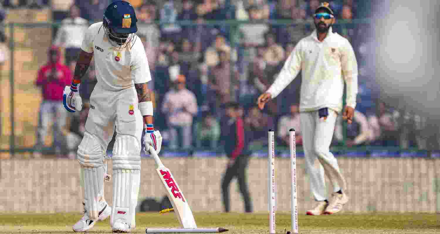 Delhi's Virat Kohli bowled out during Ranji trophy cricket match between Delhi and Railways, at the Arun Jaitley Stadium, in New Delhi, Friday.