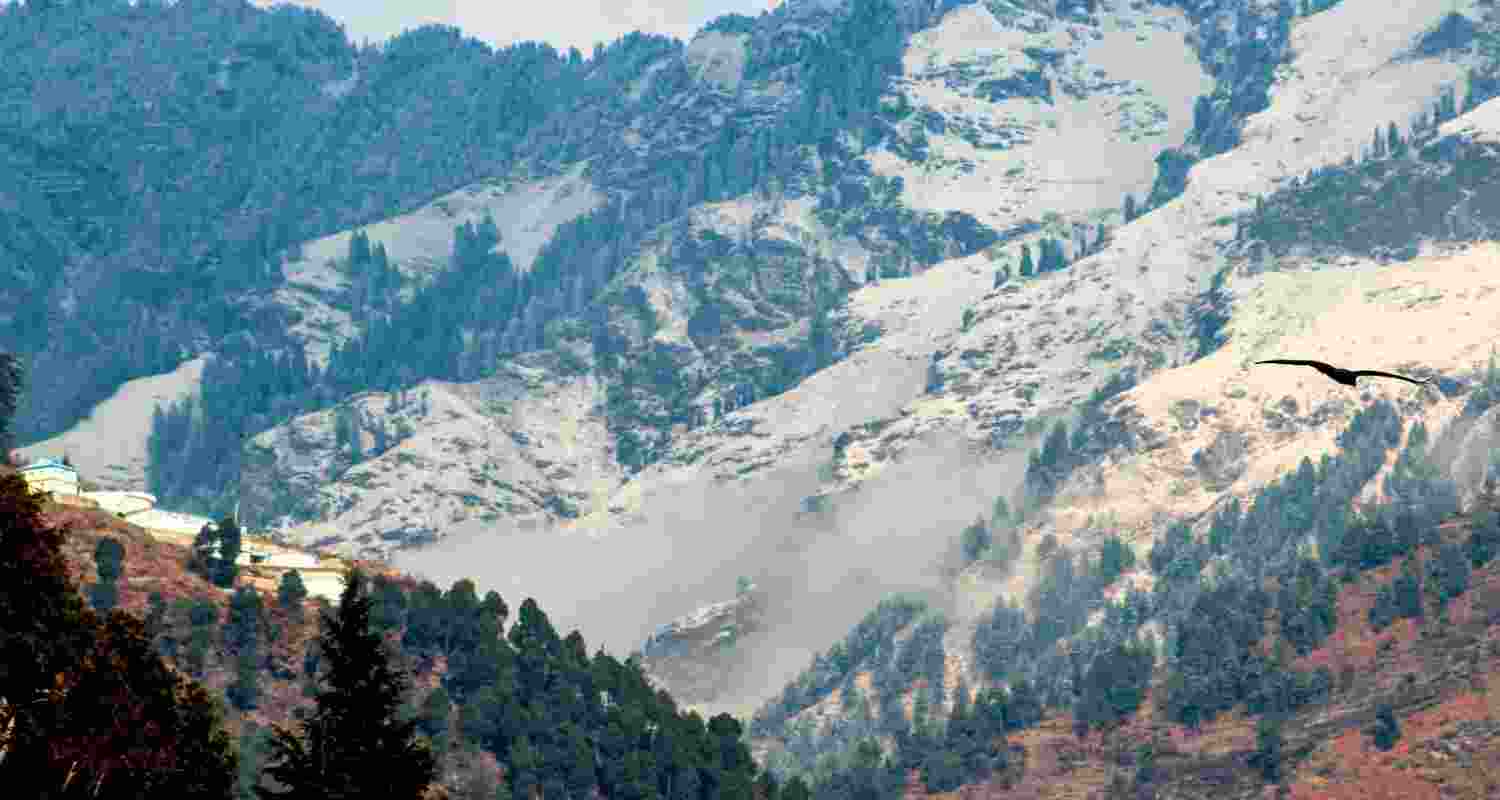 Snow covered hills after the season's first snowfall, in Kullu, Himachal Pradesh, Monday. 