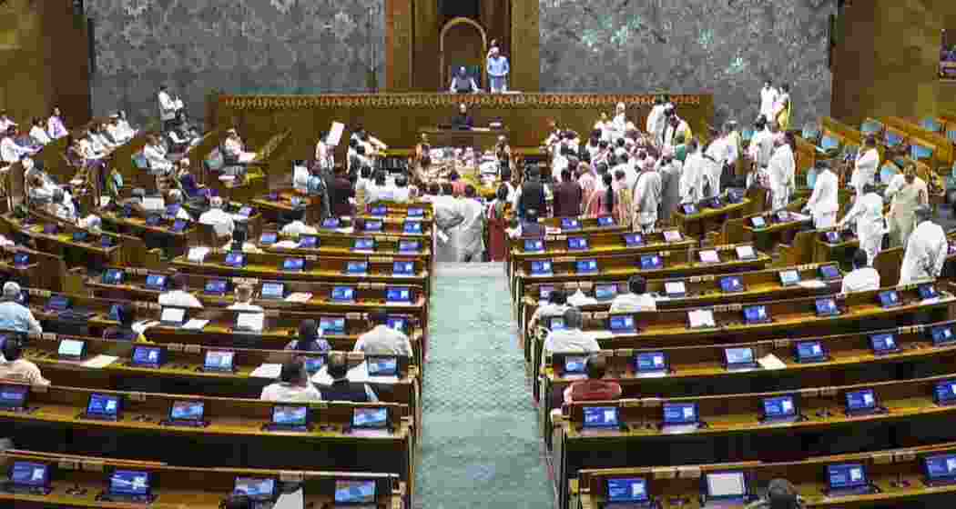 Opposition MPs protest in the Lok Sabha during the Monsoon session of Parliament.