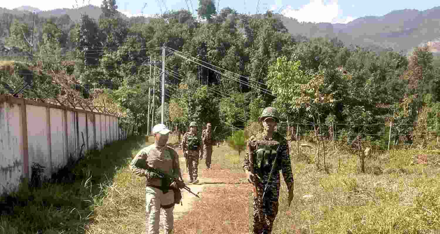 Security personnel patrol in a sensitive area of Manipur.