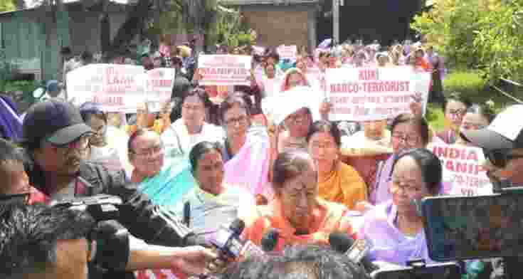 Demonstrators gather at Imphal's Palace Compound before marching towards Minister Biswajit's official residence.