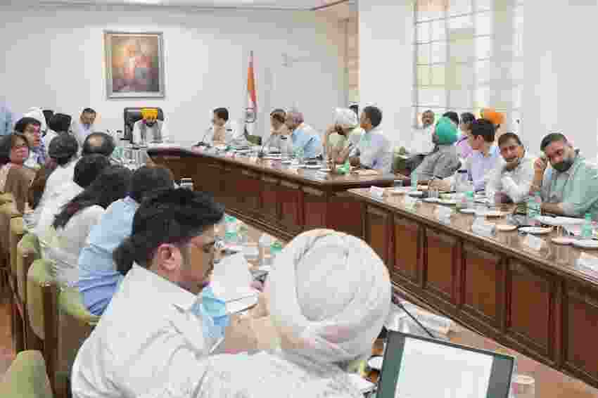 CM Mann during meeting with officials. 