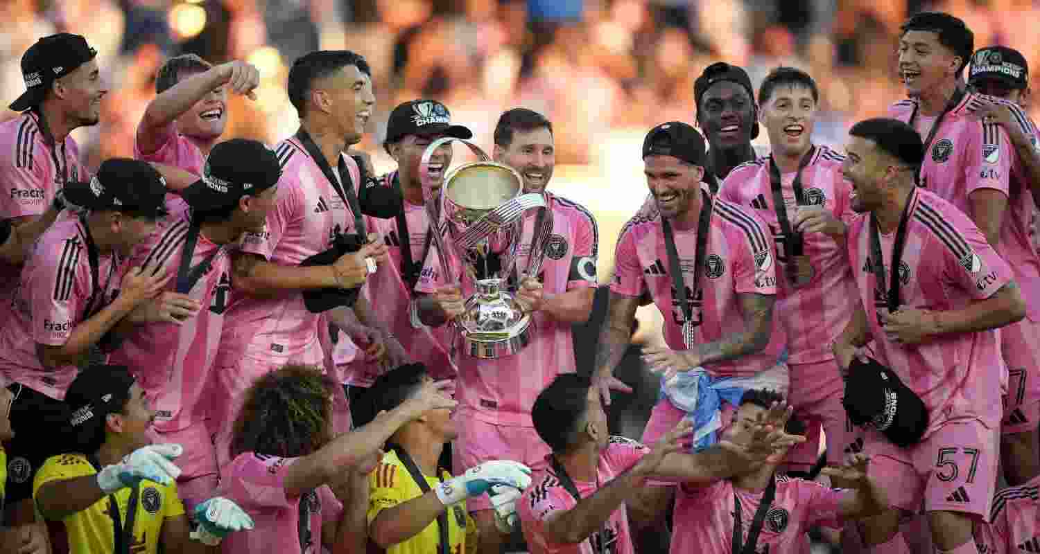Lionel Messi celebrates lifting the MLS Cup with his teammates.