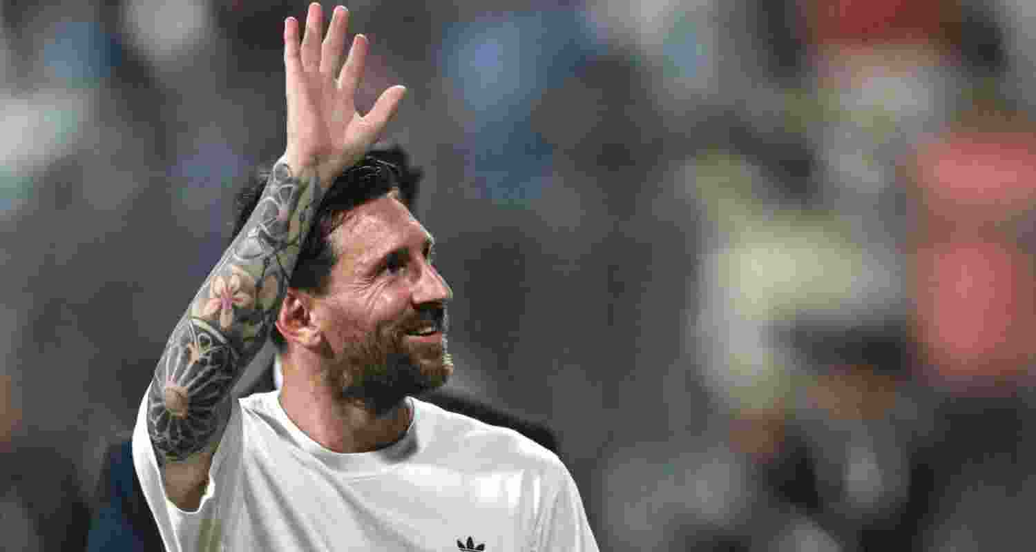 Lionel Messi waving at fans during the Delhi leg of his G.O.A.T. India Tour at the Feroze Shah Kotla Stadium in New Delhi on Monday.