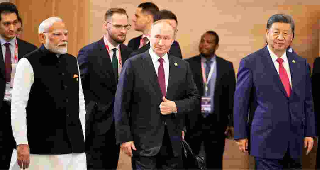 Prime Minister Narendra Modi, Russian President Vladimir Putin and Chinese President Xi Jinping attend a family photo ceremony.