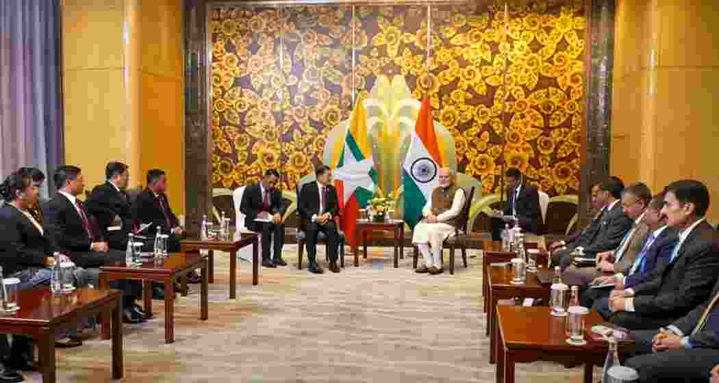 Prime Minister Narendra Modi with Myanmar Senior General Min Aung Hlaing during a meeting, on the sidelines of the SCO Summit, in Tianjin, China.