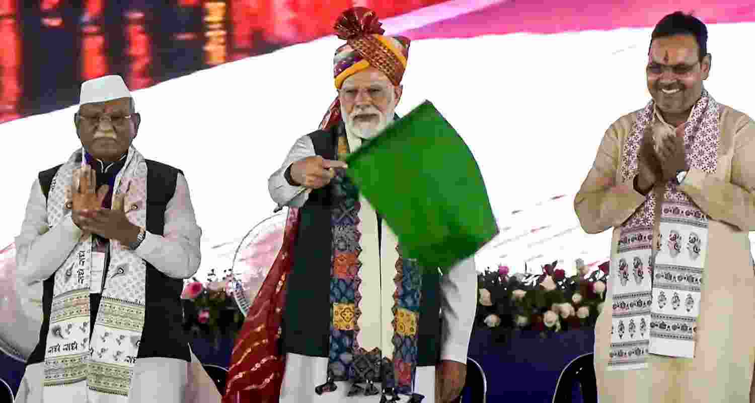Prime Minister Narendra Modi, Rajasthan Governor Haribhau Bagade and Chief Minister Bhajanlal Sharma during the inauguration and foundation stone laying of various development projects, in Banswara. 
