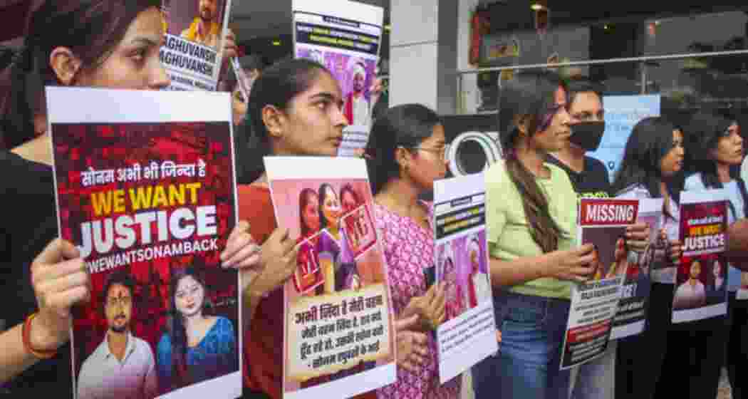 Relatives and friends of Sonam Raghuvanshi, who along with her husband Raja Raghuvanshi went missing during their honeymoon in Meghalaya, stage a protest against the Meghalaya government, in Indore, Saturday.