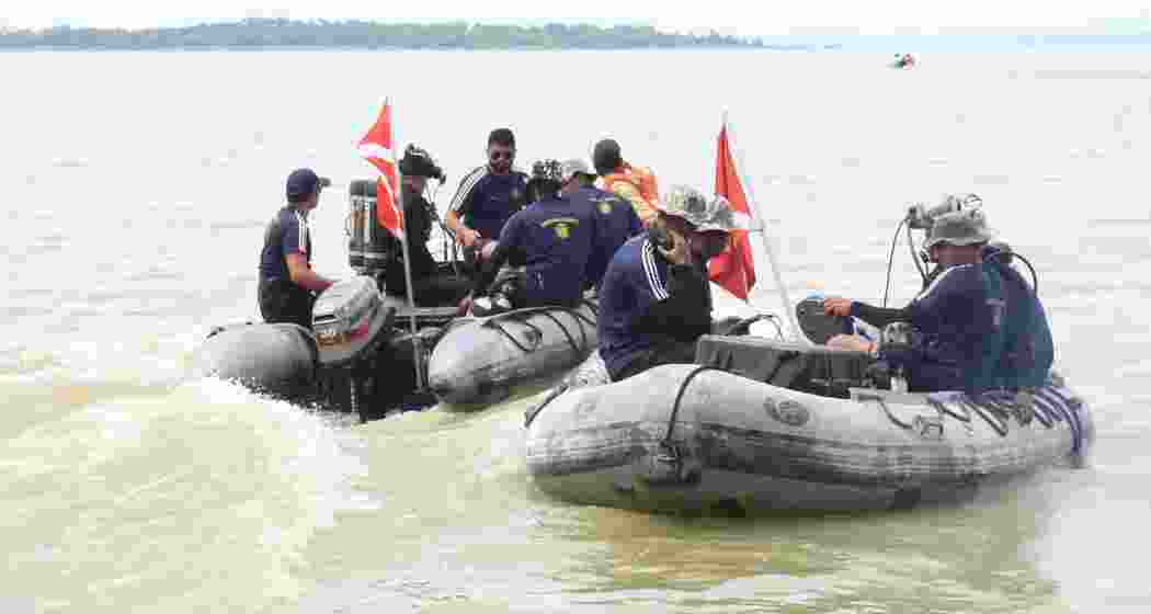 NDRF personnel conduct rescue operations to locate the submerged aircraft from Jamshedpur Dam.