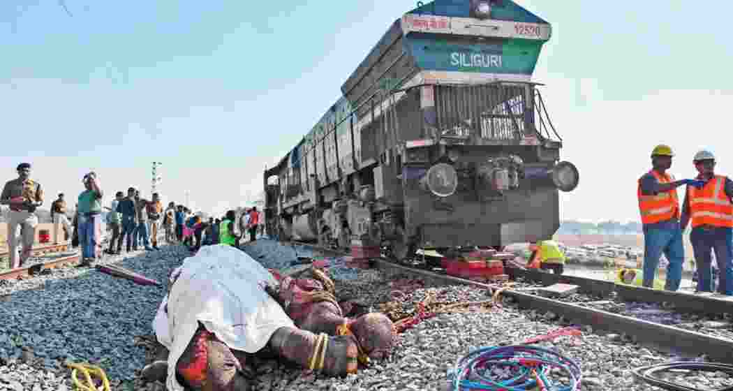 Rescue and forest teams at the site of the Rajdhani Express collision in Assam, examining damage to the train and the tragic loss of seven wild elephants.