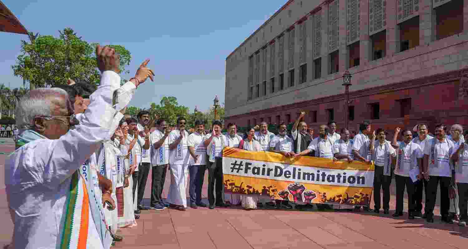 DMK MPs protest during the Budget session of Parliament, in New Delhi, Thursday.