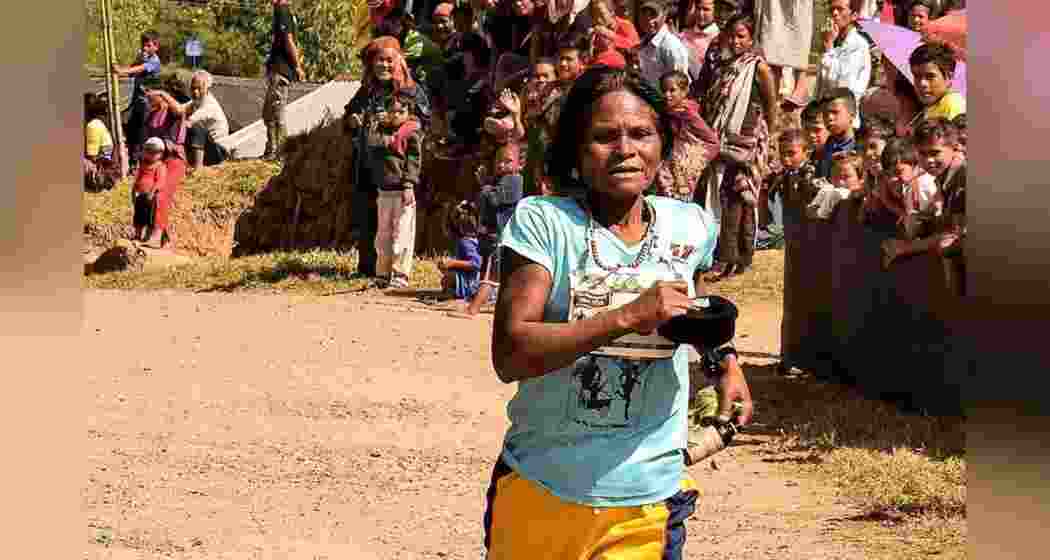 People cheer as 76-year-old marathon enthusiast Kmoin Wahlang races in her home turf in Meghalaya. (Image: X)
