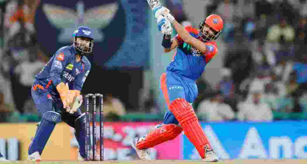 Axar Patel plays a shot as Rishabh Pant keeps wickets during the IPL 2025 match between Delhi Capitals and Lucknow Super Giants at Ekana Stadium in Lucknow on Tuesday.