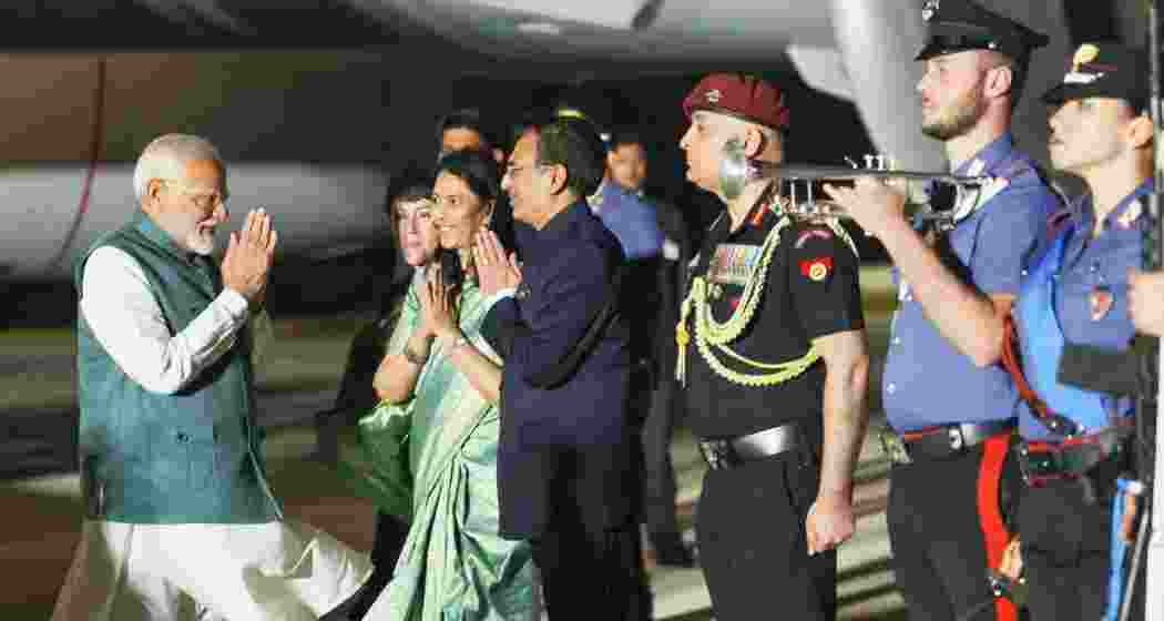 Prime Minister Narendra Modi being welcomed by Indian delegates after landing in Italy's Apulia for the G7 Summit.