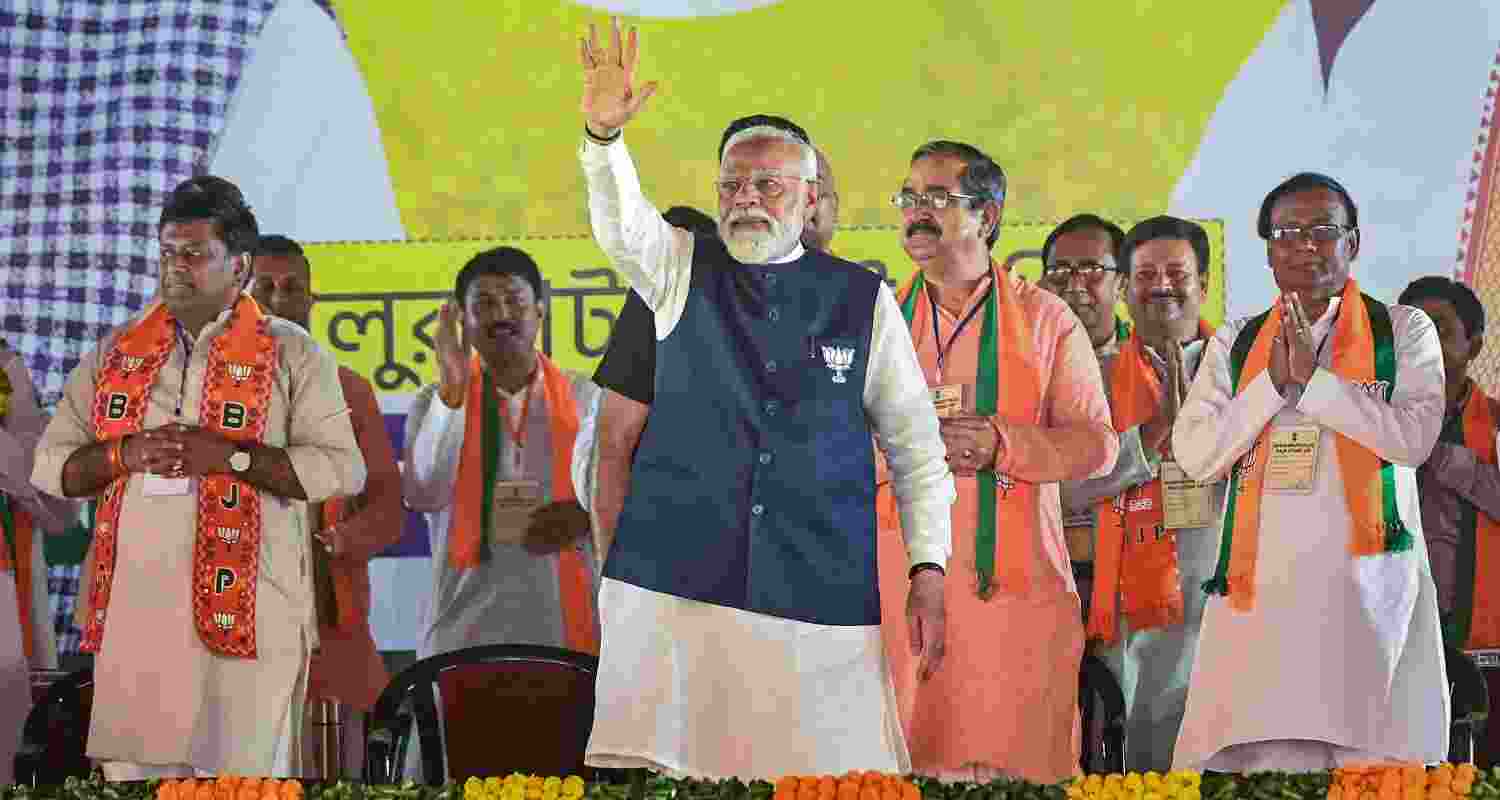 Prime Minister Narendra Modi with BJP candidate Sukanta Majumdar. 