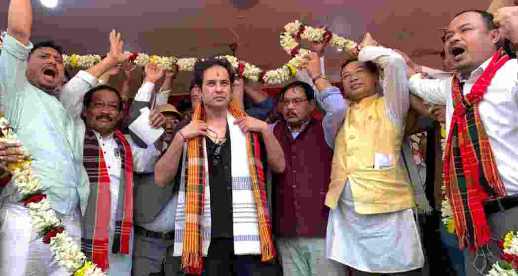 Tipra Motha Party supremo Pradyot Debbarma being felicitated with a garland by party and local leaders in Agartala.
