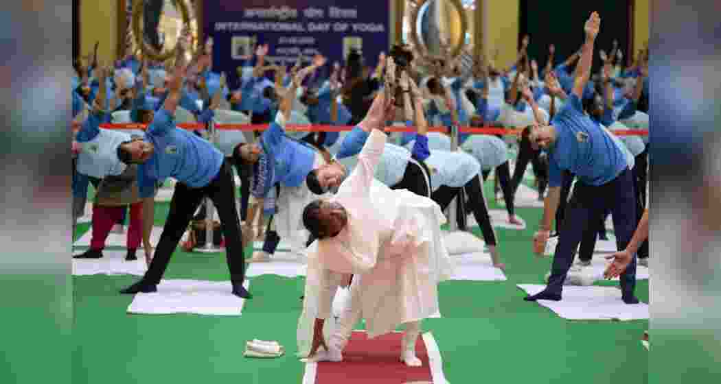 President Droupadi Murmu along with other officials of the President's Secretariat performing yoga at the Rashtrapati Bhavan on International Yoga Day.