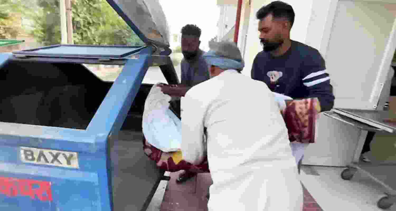 An unclaimed body being but in a garbage trolley at a civil hospital in Punjab's Phagwara.