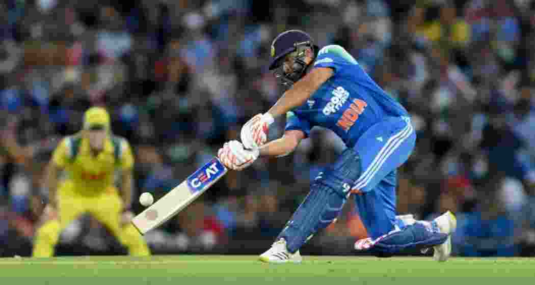 Rohit Sharma in action during an ODI match, celebrating after hitting a record-breaking six to surpass Shahid Afridi’s tally for the most sixes in One-Day International cricket.