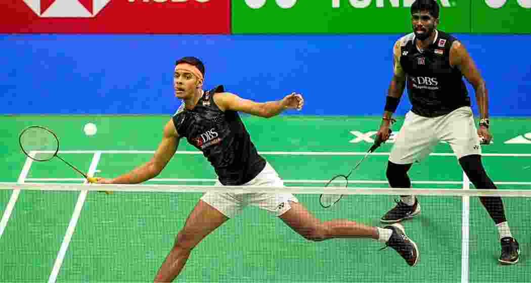 Satwiksairaj Rankireddy and Chirag Shetty in action during a men’s doubles match.
