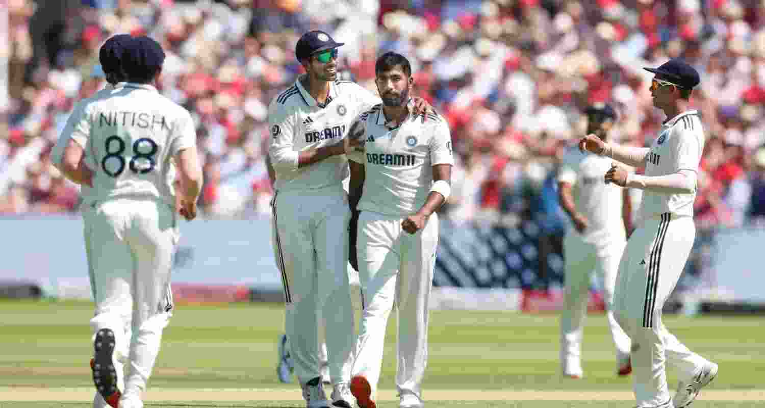 Jasprit Bumrah being congratulated by teammates after he dismissed Joe Root on the second day of the third Test match between India and England at Lord's on Friday.