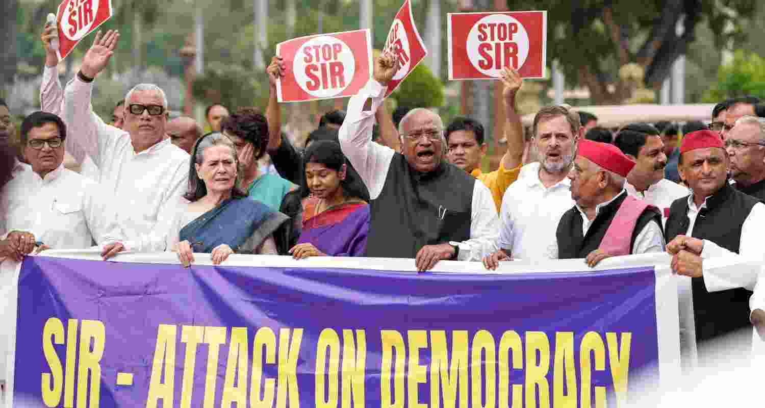 Congress chief Mallikarjun Kharge with party leader Rahul Gandhi, party MPs Sonia Gandhi, Priyanka Gandhi Vadra, DMK MP Kanimozhi Karunanidhi, Samajwadi Party MP Awadhesh Prasad and other INDIA bloc parliamentarians, stage a protest against the SIR of electoral rolls in Bihar, during the Monsoon session of Parliament, in New Delhi, July 28.