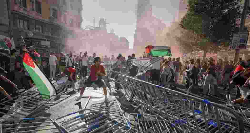 Protesters block the road in an attempt to disrupt the twenty-first stage of the Spanish cycling race La Vuelta, from Alalpardo to Madrid, Spain.