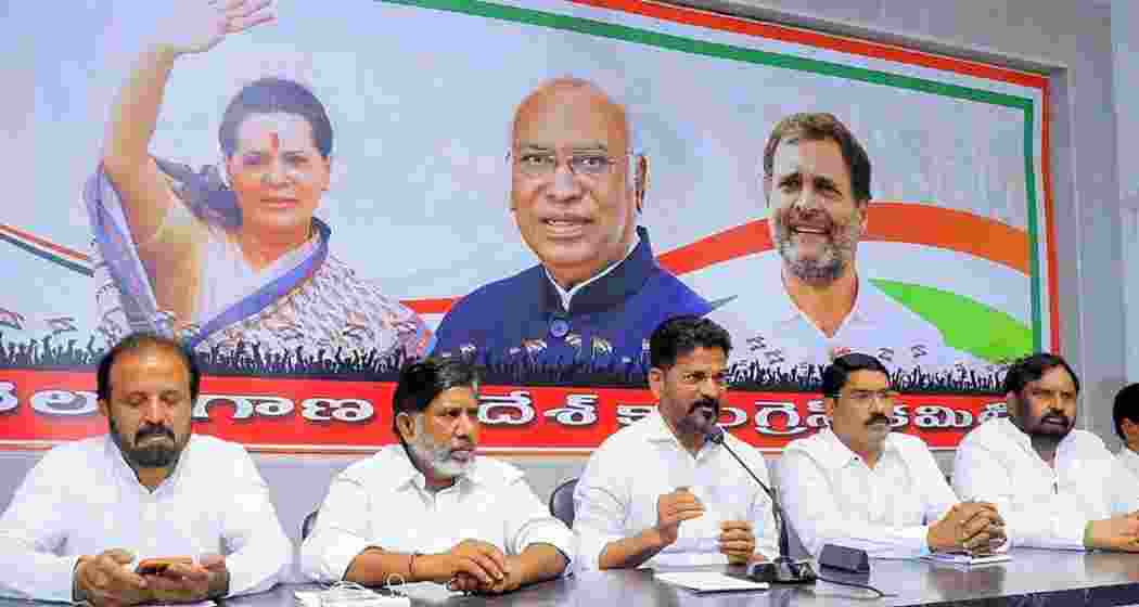 Revanth Reddy, President of the Telangana Pradesh Congress Committee (TPCC) with party leaders addresses a press conference at Gandhi Bhavan in Hyderabad. (Image: PTI)