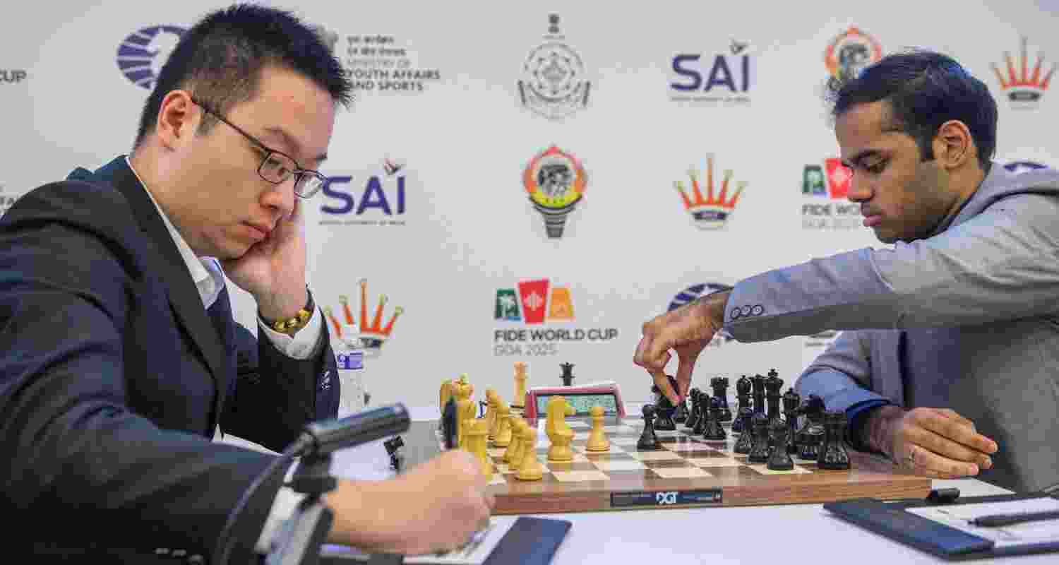Wei Yi of China and (right) Arjun Erigaisi in action during the quarterfinals of the FIDE World Cup in Panaji on Monday.