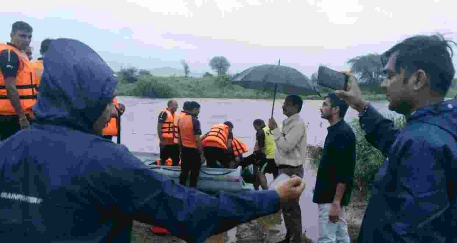 Nine people saved from swollen Sabarmati by SDRF team.