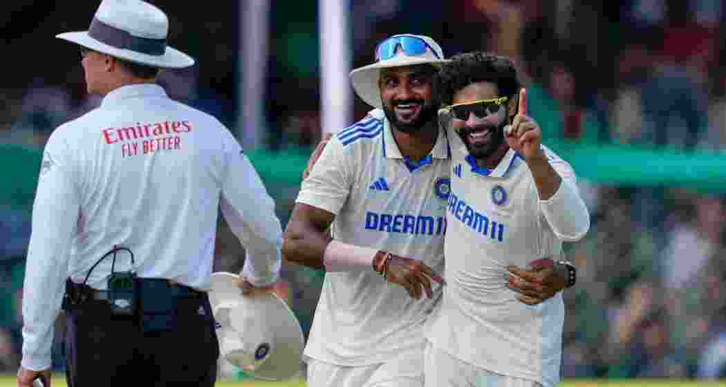 India's Ravindra Jadeja with teammates celebrates the wicket of Bangladeshi batter Khaled Ahmed during the fourth day of the 2nd Test cricket match between India and Bangladesh, at the Green Park stadium, Kanpur, Monday, Sept. 30, 2024. 
