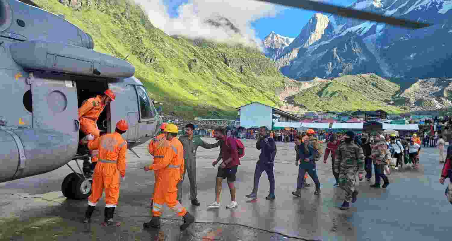  NDRF and IAF personnel conduct a rescue operation at Gaucher following the cloud burst in Uttarakhand.