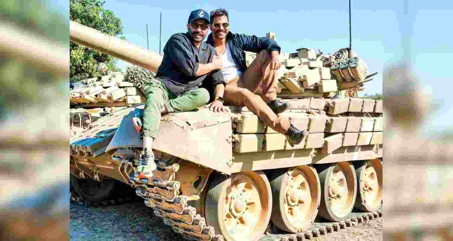Bollywood actors Sunny Deol and Varun Dhawan atop a tank during the shooting of 'Border 2' in Jhansi on Tuesday. Image: X