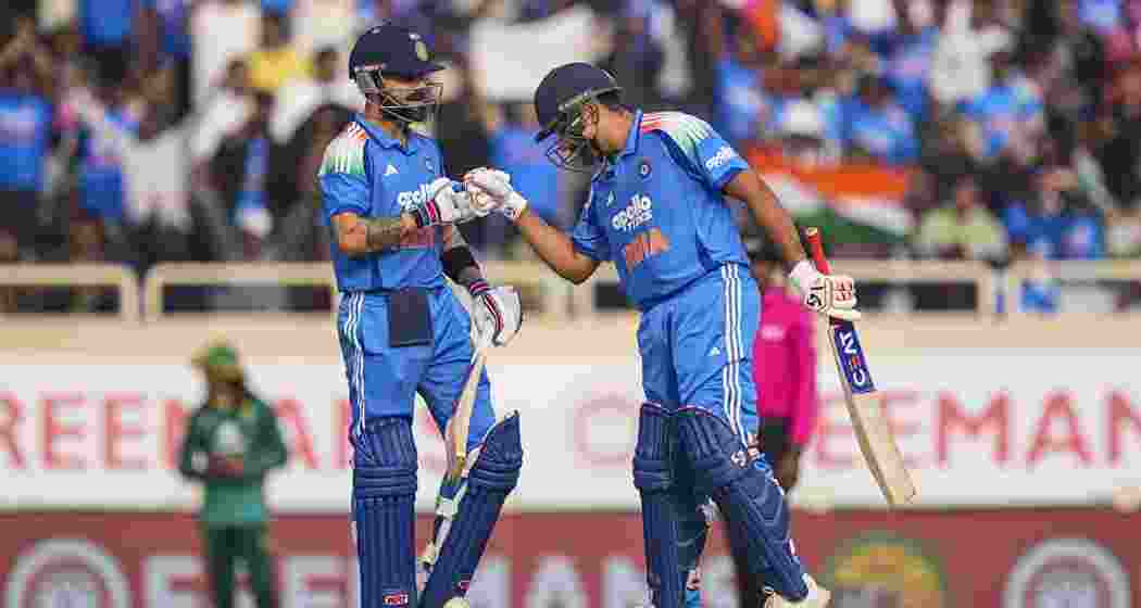 India's Virat Kohli, left, celebrates his half century with Rohit Sharma during the first ODI cricket match of a series between India and South Africa, at JSCA International Stadium Complex, in Ranchi, Jharkhand on Sunday.