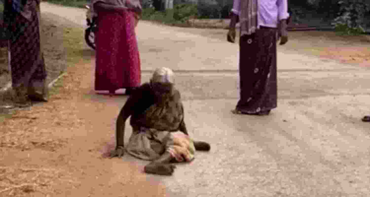 77-year-old woman in Karnataka crawls to get her pension dues.